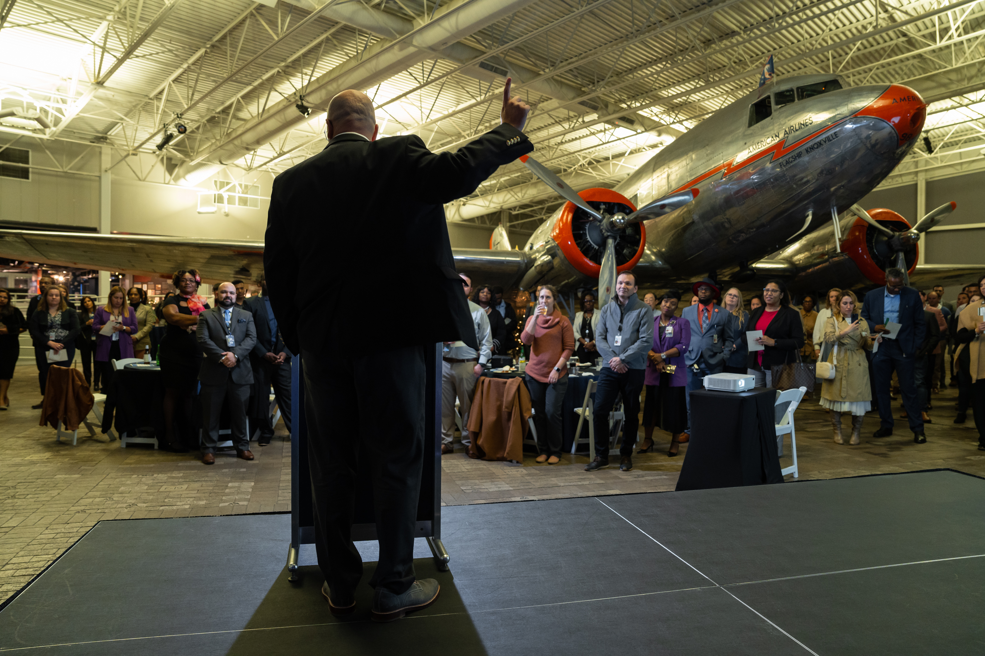 Robert Hausmann addressing a leadership audience at an American Airlines event.