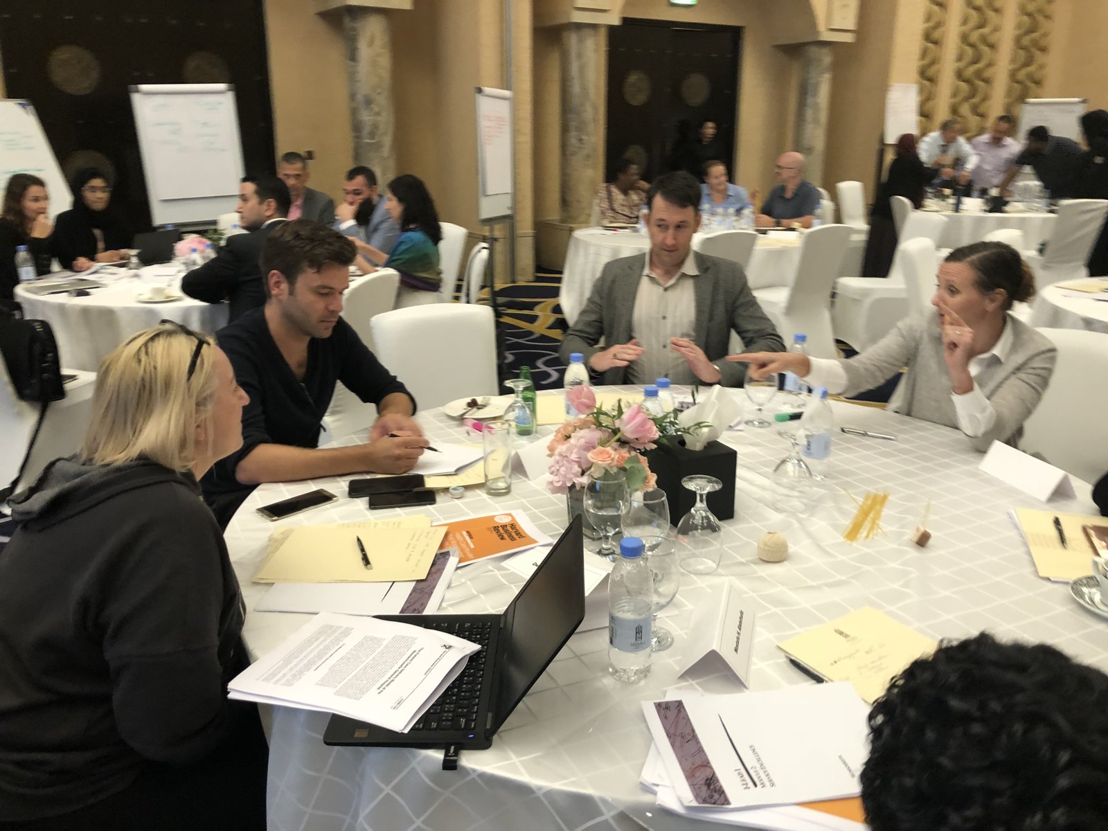 Leaders working together at a facilitation table.